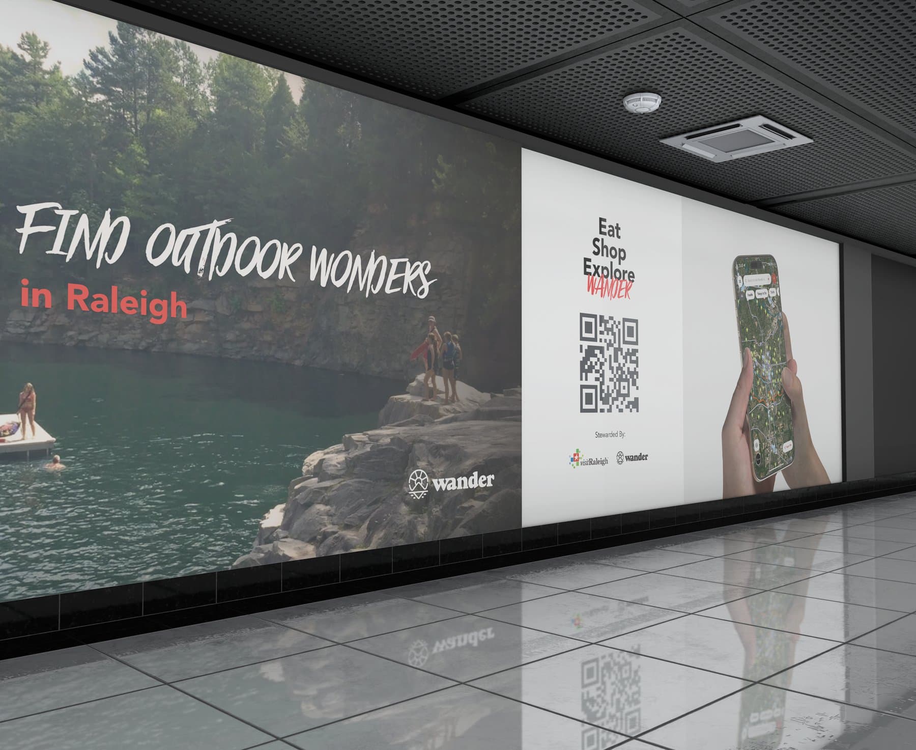 A large-format Wander wall ad for Visit Raleigh with a QR code and the app map